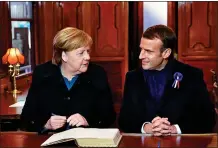  ??  ?? UNITED IN PEACE: Merkel and Macron yesterday