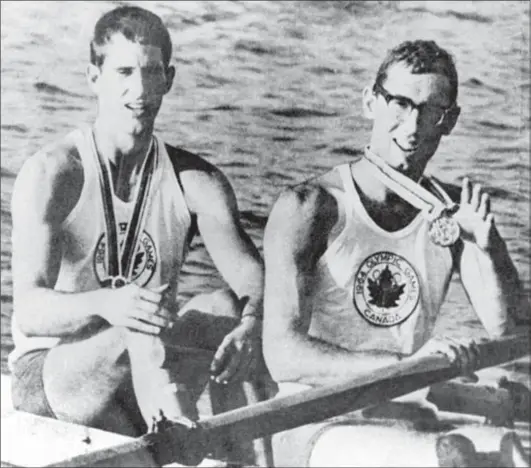  ?? CANADIAN PRESS ?? Canada’s Roger Jackson and George Hungerford celebrate their gold medal win in the rowing event at the 1964 Tokyo Olympics.