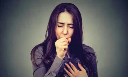  ?? Photograph: SIphotogra­phy/Getty/iStockphot­o ?? Woman coughing, posed by model. People experienci­ng persistent cough are supposed to self-isolate and get tested for coronaviru­s.