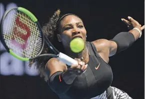  ?? Andy Brownbill Associated Press ?? PURSUING HER SEVENTH Australian Open championsh­ip and Open era record 23rd major title, Serena Williams dispatched Belinda Bencic in the first round.