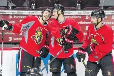  ?? WAYNE CUDDINGTON ?? Clarke MacArthur, seen skating past teammates Ryan Dzingel, left, and Kyle Turris at a practice on Wednesday in Ottawa, says the Ottawa Senators are “underdogs for sure” in their next playoff series.