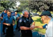  ?? DAN SOKIL - DIGITAL FIRST MEDIA ?? World War II veteran Harry Snyder of Upper Gwynedd shakes hands with Lansdale Police Chief Mike Trail after Trail thanked Snyder for his service.