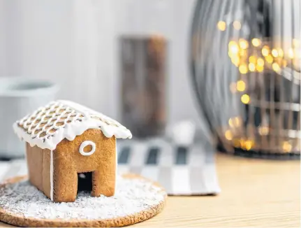  ?? 123RF ?? Skip buying a kit this year and try making a homemade gingerbrea­d house to gift family or friends.