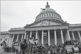  ?? JOHN MINCHILLO/AP PHOTO ?? Rioters at the U.S. Capitol on Jan. 6, 2021, in Washington.