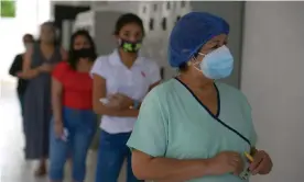  ??  ?? Women wait to vote at a polling station in Guayaquil, Ecuador, on 7 February. Photograph: Marcos Pin/EPA