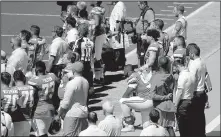  ?? AP/CHRIS CARLSON ?? Members of the Kansas City Chiefs sit in protest during the national anthem before Sunday’s game against the Los Angeles Chargers. Protests against comments made by President Donald Trump spread throughout the league.