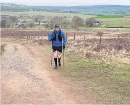  ??  ?? Uphill battle Andy Coyle continues on, roughly nine hours into the challenge