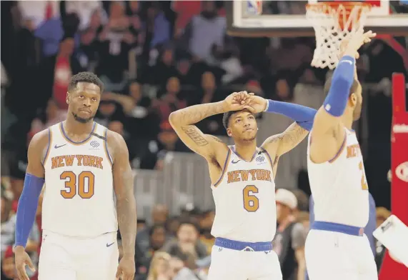  ??  ?? 0 An all too familiar scene over the past two decades, as New York Knicks players stand dejected during a match against Atlanta Hawks earlier this year.