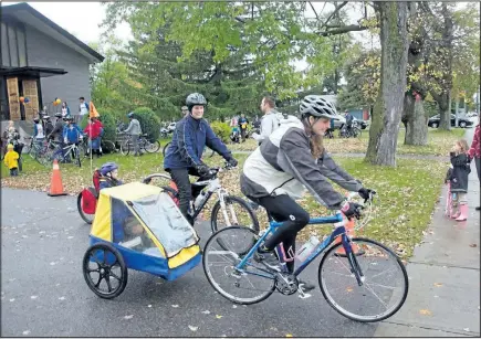  ?? SUBMITTED PHOTO ?? Trista Gilbert, with a young passenger on board, and Leanne Martin, both from the Parish, participat­e in last year’s Ride for Refuge.