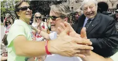  ?? MICHAEL PEAKE / POSTMEDIA NETWORK ?? Harry McMurtry, left, is met by supporters including father and former Ontario chief justice Roy McMurtry.