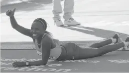 ?? | GETTY IMAGES ?? Florence Kiplagat celebrates her victory in the Chicago Marathon.