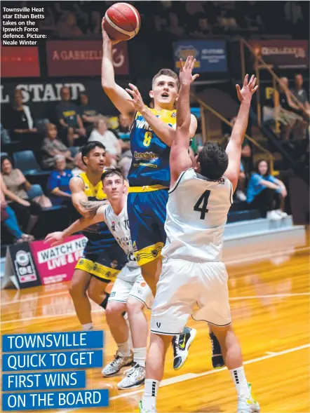  ?? ?? Townsville Heat star Ethan Betts takes on the Ipswich Force defence. Picture: Neale Winter