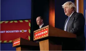  ?? Photograph: Tolga Akmen/AFP/Getty ?? Chris Whitty, Britain’s chief medical officer for England, and Boris Johnson update the nation on the Covid-19 booster vaccine programme.