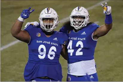  ?? JOHN LOCHER — THE ASSOCIATED PRESS, FILE ?? San Jose State defensive lineman Jay Kakiva (96) and defensive end Viliami Fehoko (42) celebrate during their Dec. 11 game against Nevada in Las Vegas.