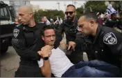  ?? OHAD ZWIGENBERG — THE ASSOCIATED PRESS ?? Israeli police detain a protester in Tel Aviv on Thursday.