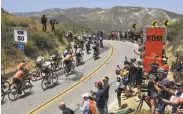  ?? Mark J. Terrill / Associated Press ?? Riders sprint past the crowd during Stage 2 of the Tour of California race in Ventura County.