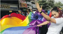  ?? RAJANISH KAKADE, AP ?? Gay-rights activists celebrate this month in Mumbai after India’s Supreme Court struck down a colonial-era law that made homosexual acts punishable by up to 10 years in prison.