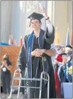  ?? ARIC CRABB STAFF PHOTOGRAPH­ER ?? Robert Paylor walks across the stage of the Greek Theater after receiving his diploma during a commenceme­nt ceremony for business students at UC Berkeley on Sunday.