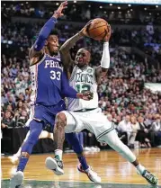  ?? Maddie Meyer / Getty Images ?? Boston’s Terry Rozier looks for a shot against Robert Covington of the 76ers in Game 5 Wednesday night. The Celtics closed out the series with the win.