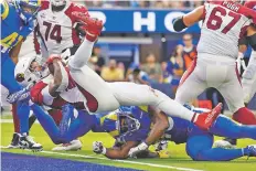  ?? ASHLEY LANDIS/ASSOCIATED PRESS FILE PHOTO ?? Cardinals running back James Conner, top, scores a touchdown during Sunday’s game in Inglewood, Calif.