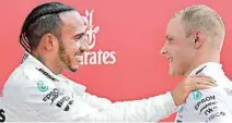  ?? AP/PTI ?? Mercedes driver Lewis Hamilton of Britain (left) celebrates with second placed Mercedes driver Valtteri Bottas of Finland after winning the German F1 Grand Prix at the Hockenheim­ring racetrack in Hockenheim, Germany, on Sunday