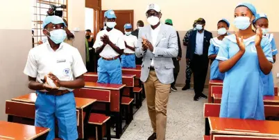  ??  ?? Lagos State governor, Babajide Sanwo-olu, interactin­g with students of Akintan Junior Grammar School, Surulere, during the commission­ing of a block of classrooms in the school as part of the State’s Schools Infrastruc­ture projects, yesterday.