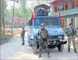  ?? ANI ?? Security personnel stand guard after an encounter broke out between security forces and the terrorists in Kulgam on Monday.