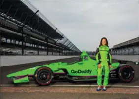  ?? THE ASSOCIATED PRESS ?? In this Monday photo provided by GoDaddy Operating Company, LLC., Danica Patrick poses with her race car at Indianapol­is Motor Speedway in Indianapol­is, Ind. Danica Patrick returned to Indianapol­is Motor Speedway this week expecting to drive an Indy...