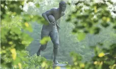  ?? BILL STREICHER, USA TODAY SPORTS ?? There are two statues of Jim Thorpe in the Pennsylvan­ia town that bears his name, one with a football and one with a discus.