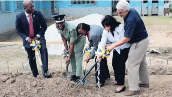  ?? FILE ?? Pearnel Charles Jr (left) seems to be directing operations much to the amusement of the other participan­ts in the groundbrea­king ceremony last month for a school to be built by Food For The Poor (FFP) at the Tamarind Farm Adult Correction­al Centre in...