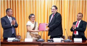  ??  ?? President of CA Sri Lanka, Mr. Manil Jayesinghe and Vice Chancellor of the University of Kelaniya, Senior Prof. Nilanthi de Silva exchanging the MoU.