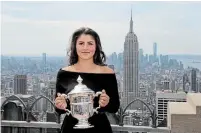  ?? CHARLES KRUPA THE ASSOCIATED PRESS ?? Bianca Andreescu poses with the U.S. Open women's singles championsh­ip trophy at Top of the Rock on Sept. 8 in New York.