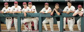  ?? NWA Democrat-Gazette/BEN GOFF ?? Players watch from the dugout during the closing stages of Arkansas’ final loss to Oregon State at the College World Series on Thursday. Several key players from the team will return next season.