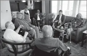  ?? Arkansas Democrat-Gazette/STEPHEN B. THORNTON ?? Administra­tor Lindsey Cleburne, second from right, visits with residents in a common lounge area Wednesday in a cottage at the new Arkansas State Veterans Home Wednesday in North Little Rock.