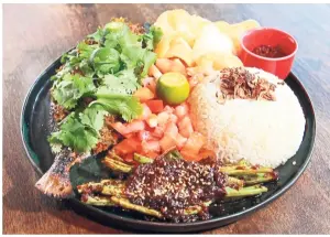  ??  ?? A homemade sambal is the key component in the success of the grilled marinated pomfret.