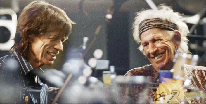  ??  ?? Satisfacti­on guaranteed: Sir Mick Jagger, left, and Keith Richards back in the studio as they record tracks for the Rolling Stones’ new album Blue & Lonesome