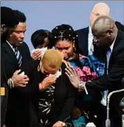  ?? Matt Rourke / Associated Press ?? Tiffany Whitfield, a granddaugh­ter of Ruth Whitfield, a victim of the Tops market shooting, is overwhelme­d with emotion during a news conference in Buffalo on Monday.