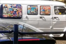  ?? COURTESY LESLEY ABRAVANEL / AP ?? This November 2017 photo of a white van in Florida whose windows were covered with an assortment of political stickers is believed to be the same one owned by Cesar Sayoc, and which was confiscate­d Friday by the FBI.