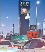  ?? (Andrea Samuels) ?? FORMER ‘BIG BROTHER’ contestant Ben Wiernik appears on a large advertisin­g board, deep in prayer.