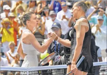  ?? USA TODAY SPORTS ?? Simona Halep (left) congratula­tes Kaia Kanepi after losing 62, 64 on Day One of the US Open in New York on Monday.