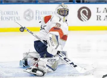  ?? CHRIS O'MEARA/AP ?? Panthers goaltender Roberto Luongo makes a blocker save on a shot by Tampa Bay Lightning center Steven Stamkos during the second period of Tuesday night’s game in Tampa.