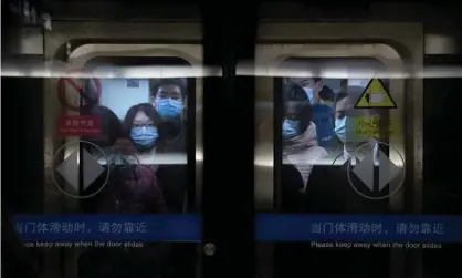  ?? Photograph: Mark Schiefelbe­in/AP ?? Commuters in Beijing on Wednesday. Officials reportedly took anal swabs from residents of areas with confirmed Covid cases in the capital last week.