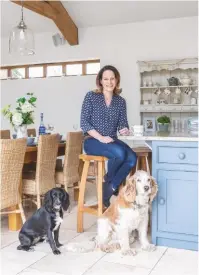  ??  ?? kitchen- diner ‘this is my favourite room, as we spend all our time here together and it’s also where i run my business from,’ says Lucy. Bespoke Shaker-style cabinetry, Handmade Kitchens Direct. Units painted in Skimming Stone estate eggshell, £60 for 2.5L, Farrow &amp; Ball