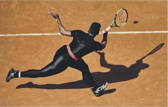  ??  ?? 2 Clad in a black catsuit with red trim, Serena Williams purred to a straightse­ts victory over Czech Kristyna Pliskova in the first round of the French Open.