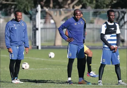  ??  ?? THE MAJOR, THE CAPTAIN AND TEKO: Lehlohonol­o Majoro, Lebogang Manyama and Teko Modise prepare for a training drill during a recent session at Green Point.