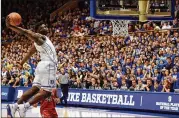  ?? GRANT HALVERSON/GETTY IMAGES ?? Duke’s Zion Williamson came to the Blue Devils surrounded by hype — and has somehow surpassed expecation­s. His soaring dunks, like this one in the first half against the St. John’s, and intimidati­ng blocks seem to have him as a lock for the No. 1 pick in the NBA Draft.