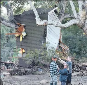  ?? Robyn Beck AFP/Getty Images ?? MUDSLIDES like the Montecito disaster last week are considered f lood events for insurance purposes, although few inland Southern California­ns have coverage.