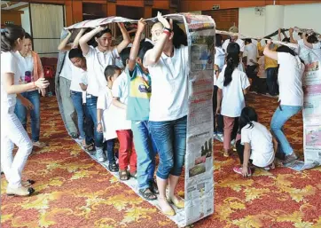  ?? PROVIDED TO CHINA DAILY ?? Children with HIV/AIDS play games at a summer camp last week in Kunming, Yunnan province. Some 30 children aged 10 to 15 participat­ed in the camp.