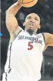  ?? THE ASSOCIATED PRESS ?? “We can do it. We did it last year and I think we can do it again,” San Diego State’s Lamont Butler said about upsetting a No. 1 seed.