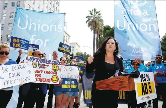  ??  ?? In this file photo, Assemblywo­man Lorena Gonzalez, D-San Diego, speaks at rally calling for passage of AB5, her measure to limit when companies can label workers as independen­t contractor­s at the Capitol in Sacramento, California. A battle between the powerhouse­s of the so-called gig economy and big labor could become the most expensive ballot measure on Nov 3, 2020, in California history. Voters are being asked to decide via Propositio­n 22 whether to create an exemption to a new state law aimed at providing wage and benefit protection­s to Uber, Lyft and
other app-based drivers. (AP)
